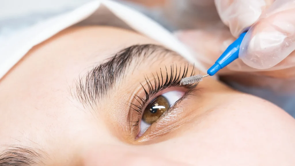 Close-up of eyelashes after an eyelash tint treatment showing darker, fuller lashes without mascara.